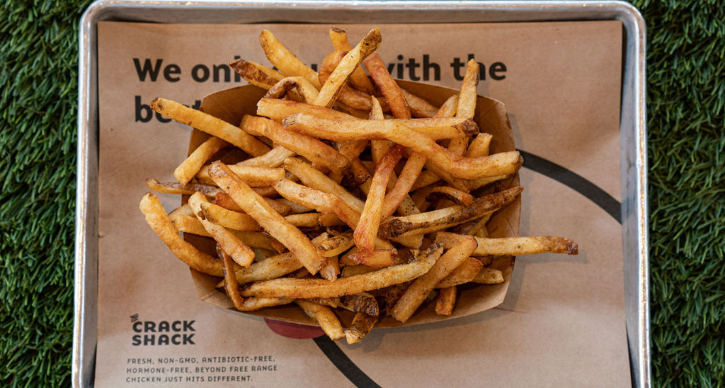 Overhead image of fries in a boat on a tray